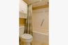 The King Neptune Suite's bathroom has a separate dressing area with a single granite topped maple vanity and lots of storage. The separate shower and toilet gives added privacy.