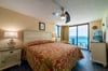 The king sized master bedroom opens on to the balcony overlooking the beach.