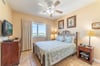 The cozy Guest Bedroom has a luxury queen bed and a large closet.