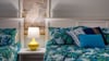 Bright colorful bedding in the master bedroom suite is sure to please!