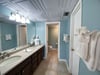 You Sea Shells Main Bath features a dressing area with double vanities, and a large walk-in closet