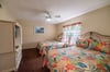 The parrot paradise guest bedroom offers two queen beds with heavenly pillows