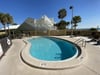 The swimming pools are beach front and located right next to the grilling areas