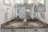 Master bath offers double vanities and a large soaking tub