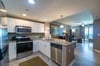 Large kitchen with stainless steel appliances
