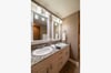 En-suite master bath with double vanities, walk-in shower, and soaking tub