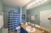 En-suite master bath with single vanity and tub/shower combo
