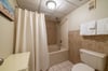 The soaking tub-shower and toilet are in a separate space for added privacy.