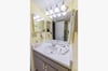 Single vanity with wall mounted hair dryer
