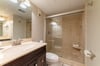 You bathroom has an elegant walk in shower, high end cabinetry and granite counter tops.