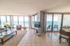Floor to ceiling windows across the front of your condo