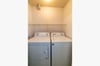 Full sized washer & dryer is located in the kitchen area.