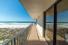 The balcony wraps around the end of the building for maximum beach views.