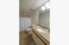 Salty Beach guest bath offers a tub/shower combo with single vanity