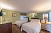 The Seagull's Hideaway Guest Bedroom #2 features two full sized beds with high thread count linens